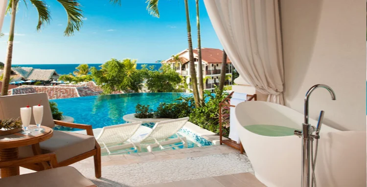 Sandals Grenada—Upgrade to a special room with more ambiance. This room spells romance all over. Infinity Edge plunge pool that blends with the horizon in this Sky Pool Suite with tub on deck.. Picture by Bill Ross Photography.