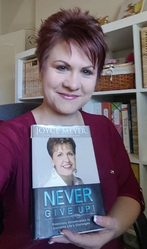 me holding Joyce Meyer book.jpg