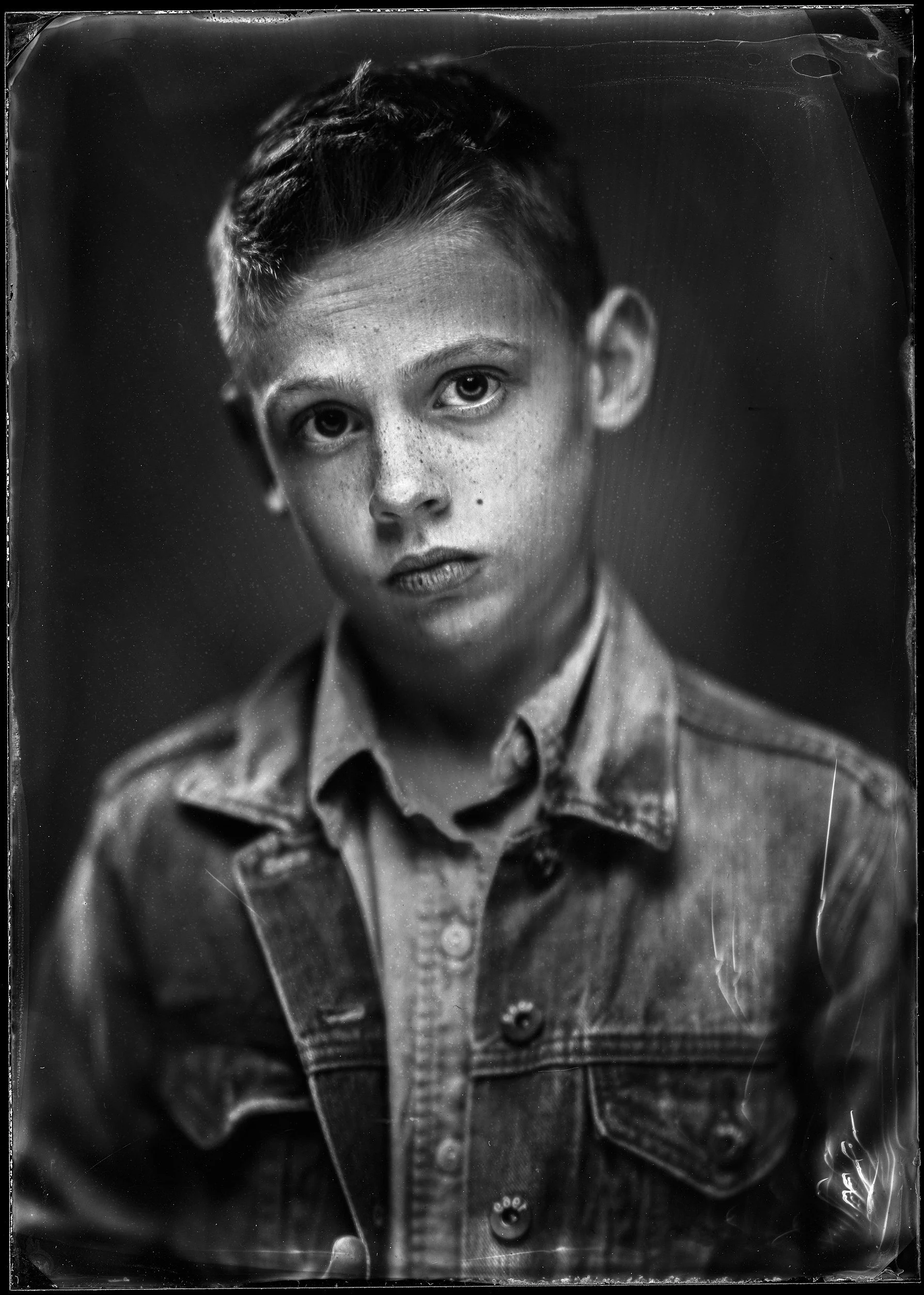 22-families-boy-in-a-denim-jacket-with-a-direct-unguarded-expression-wet-n51.jpg