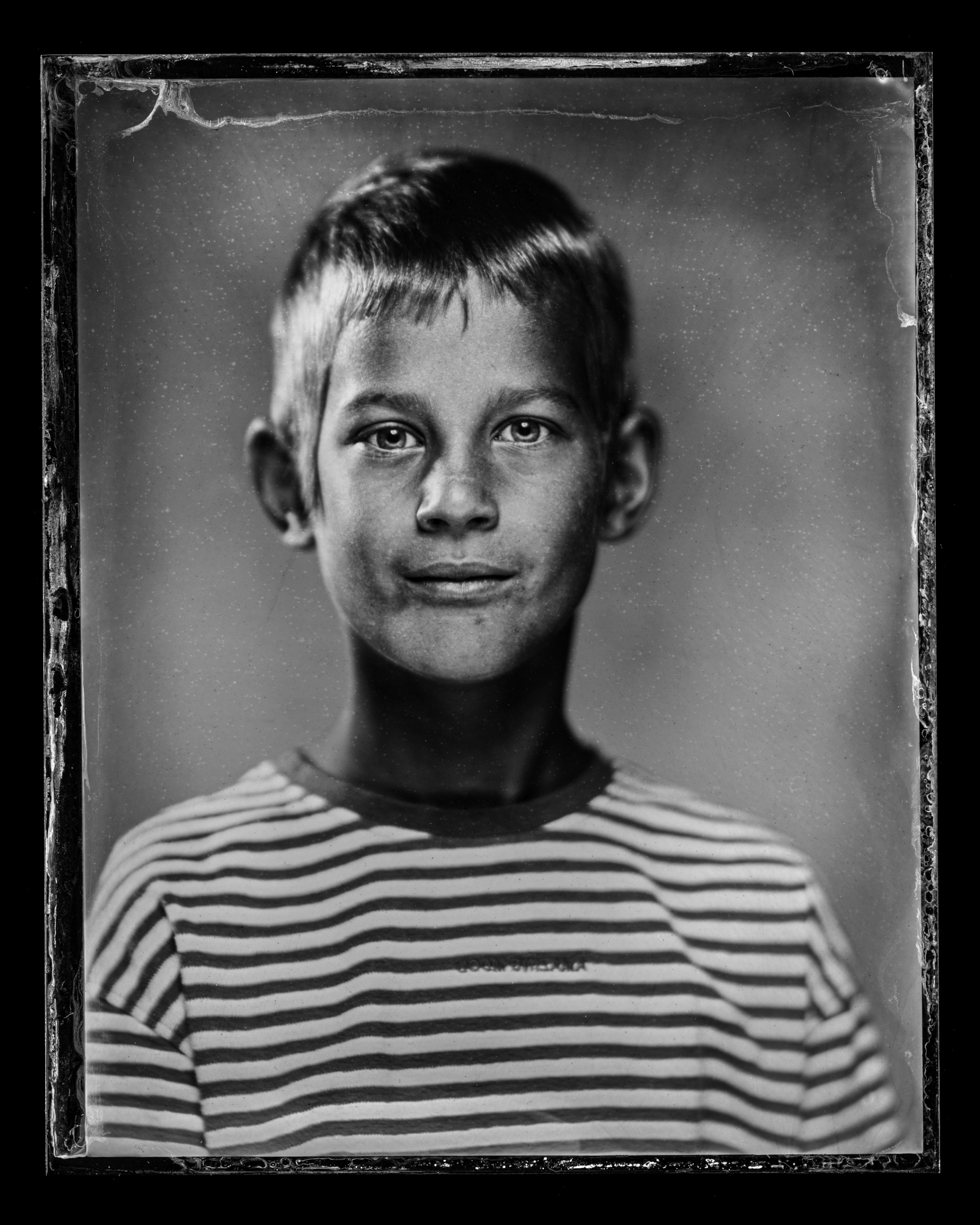 37-families-a-young-boy-with-short-hair-wearing-a-striped-shirt-looking-a169.jpg