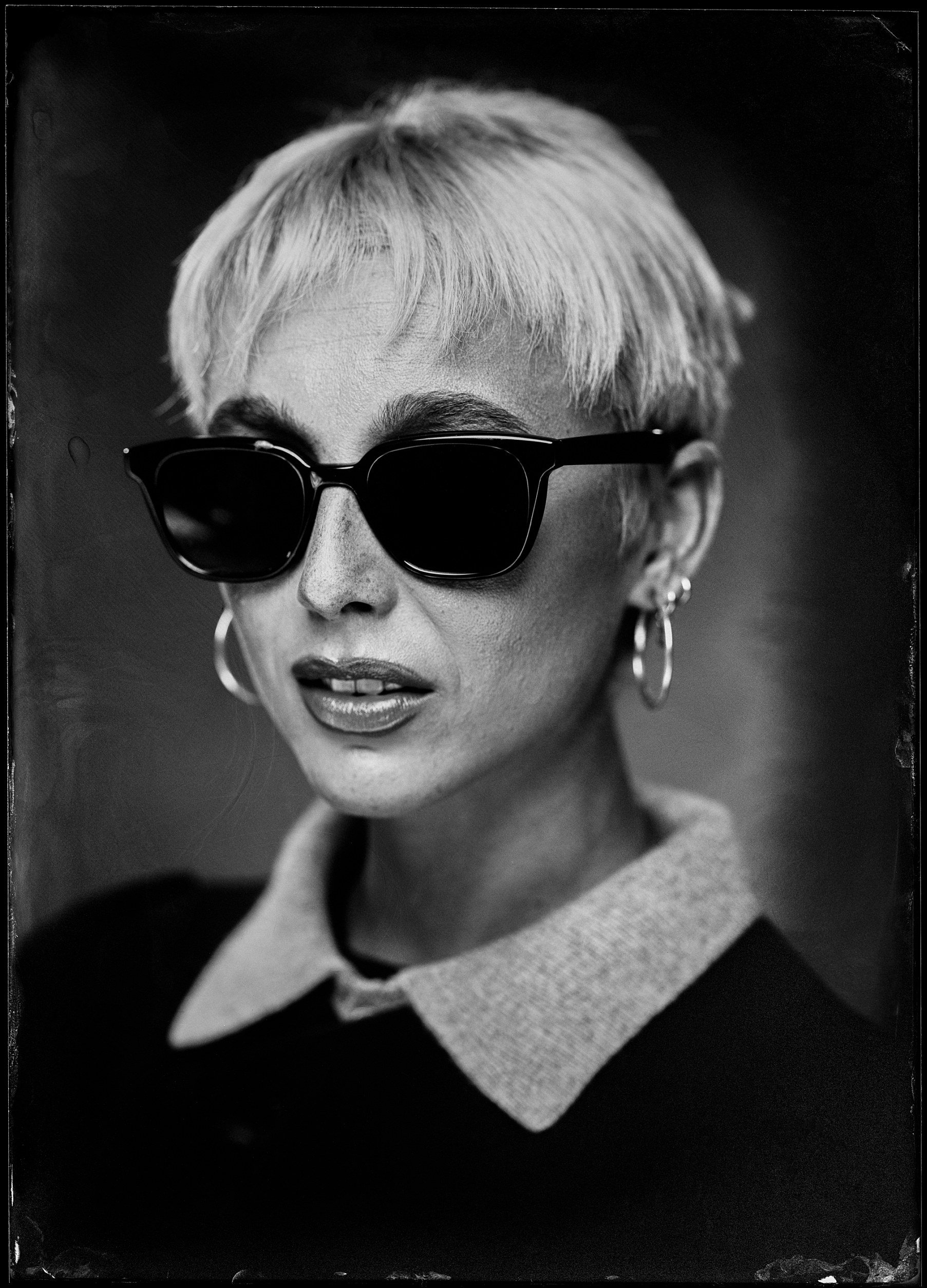 Emma Chamberlain in sunglasses, tintype portrait made backstage at Kilby Block Party
