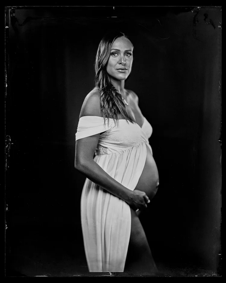 Pregnant woman in a white dress, wet plate collodion maternity portrait