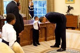 Young Boy Touching Obama's Hair