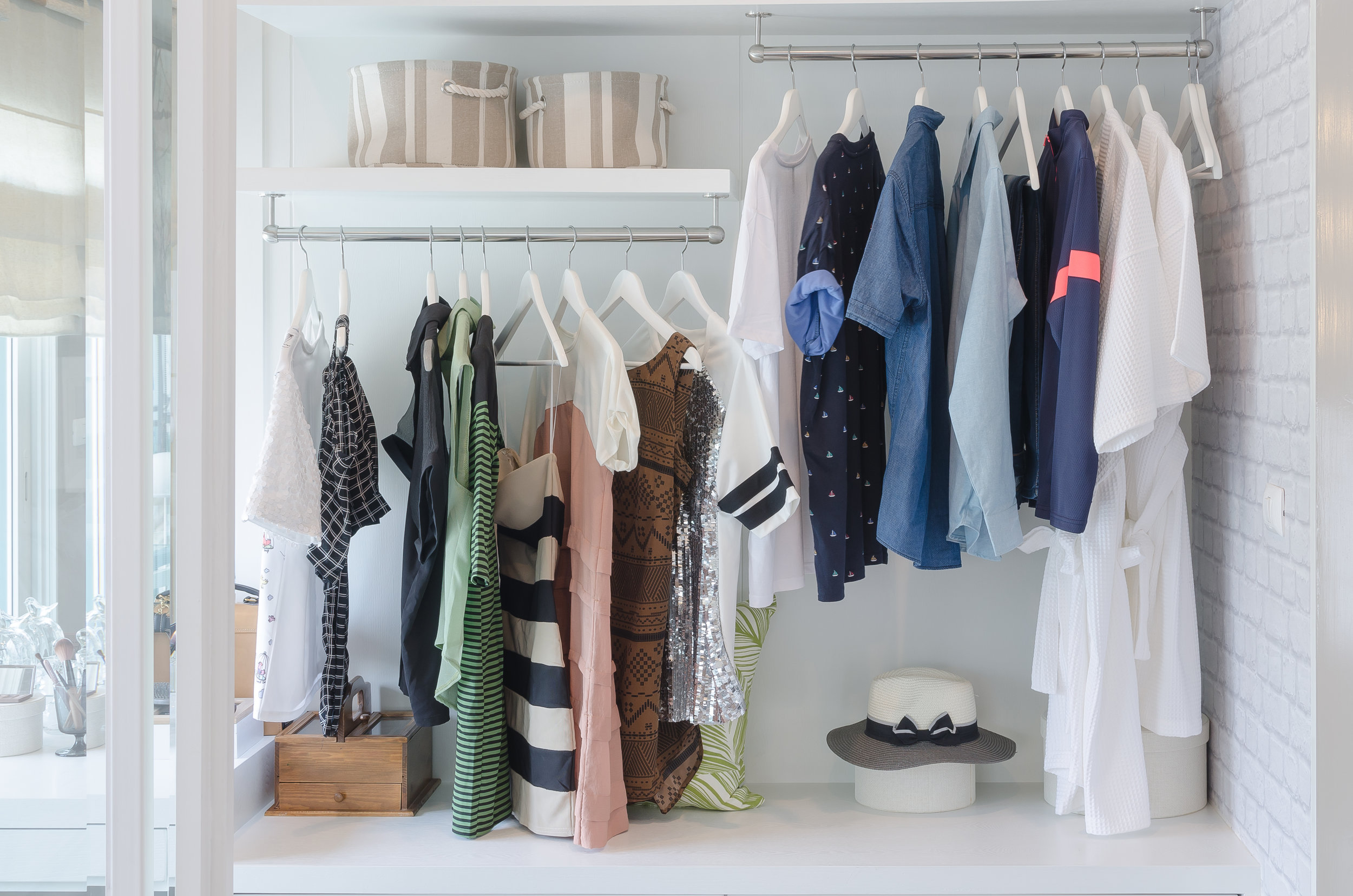 bigstock-Clothes-Hanging-In-Closet-With-111213401.jpg