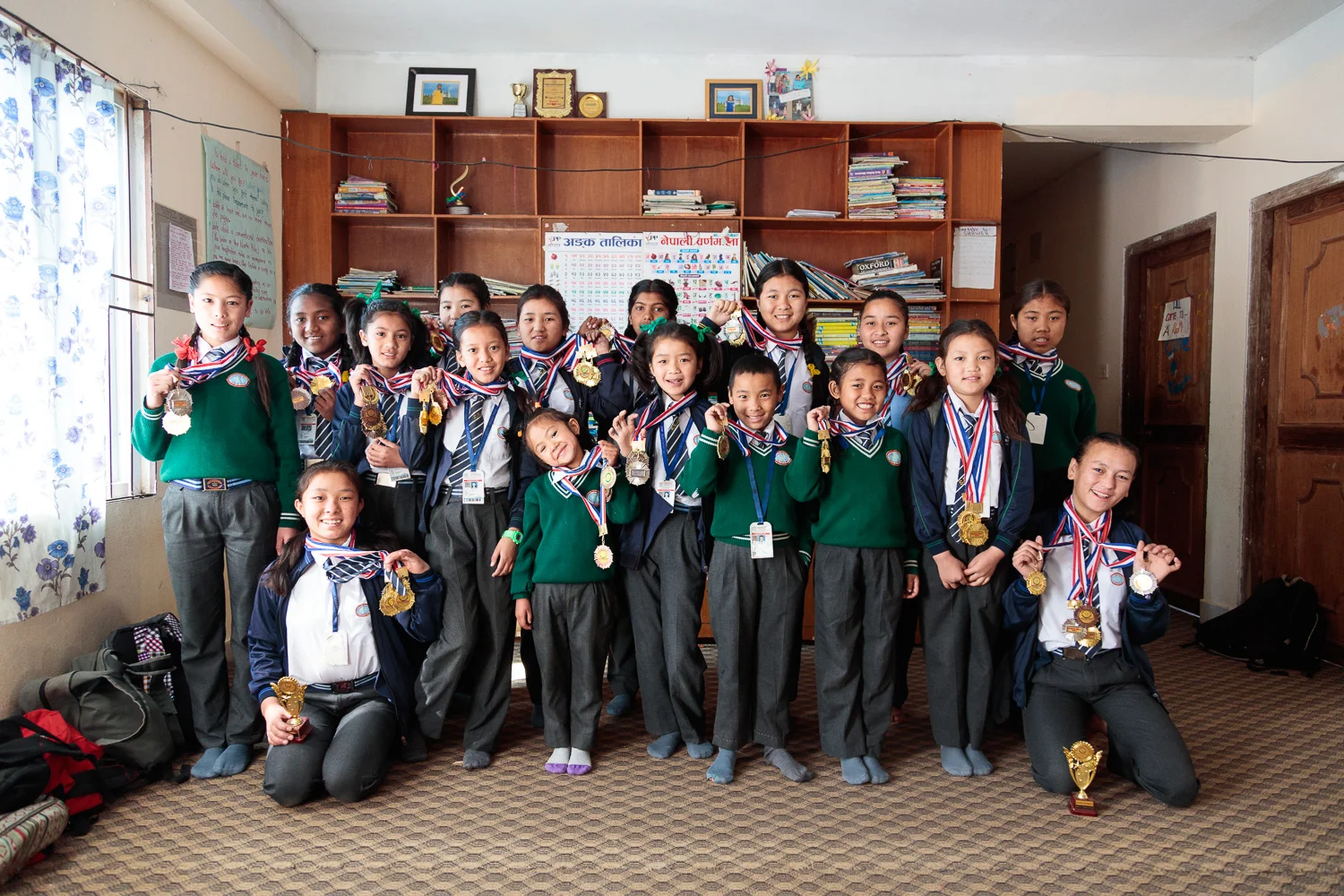 The girls at Himalayan Hope Home proudly present their athletics medals
