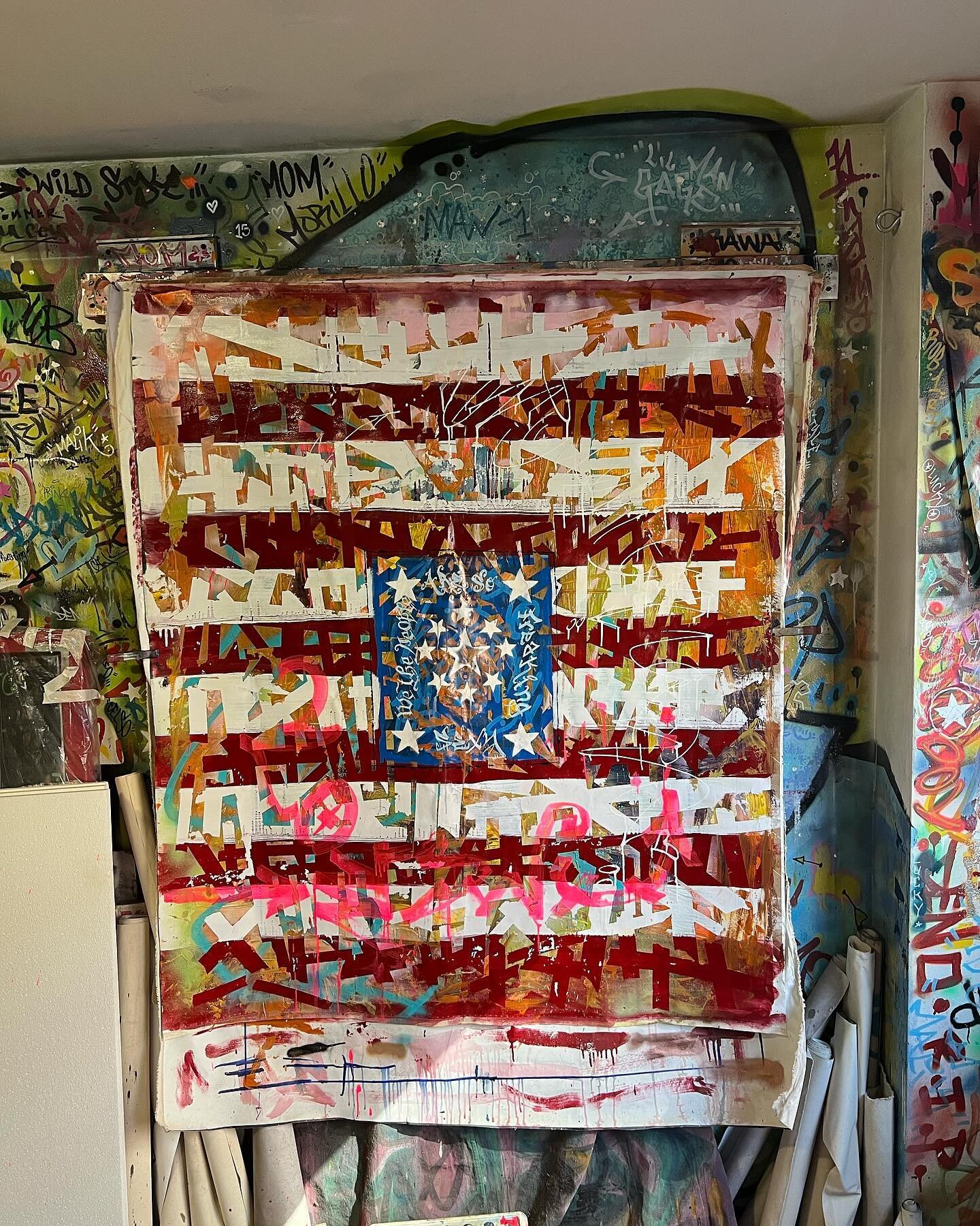 Live from the &ldquo;SEN-1&rdquo; Lab at the moment.

My latest Abstract-Graffiti style, American Flag painting  hanging out drying. 
Some people might not know, that oil paints can take weeks and depending on the amount of texture even months, unlik