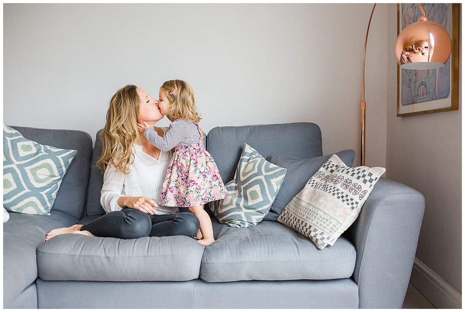 toddler kissing mum