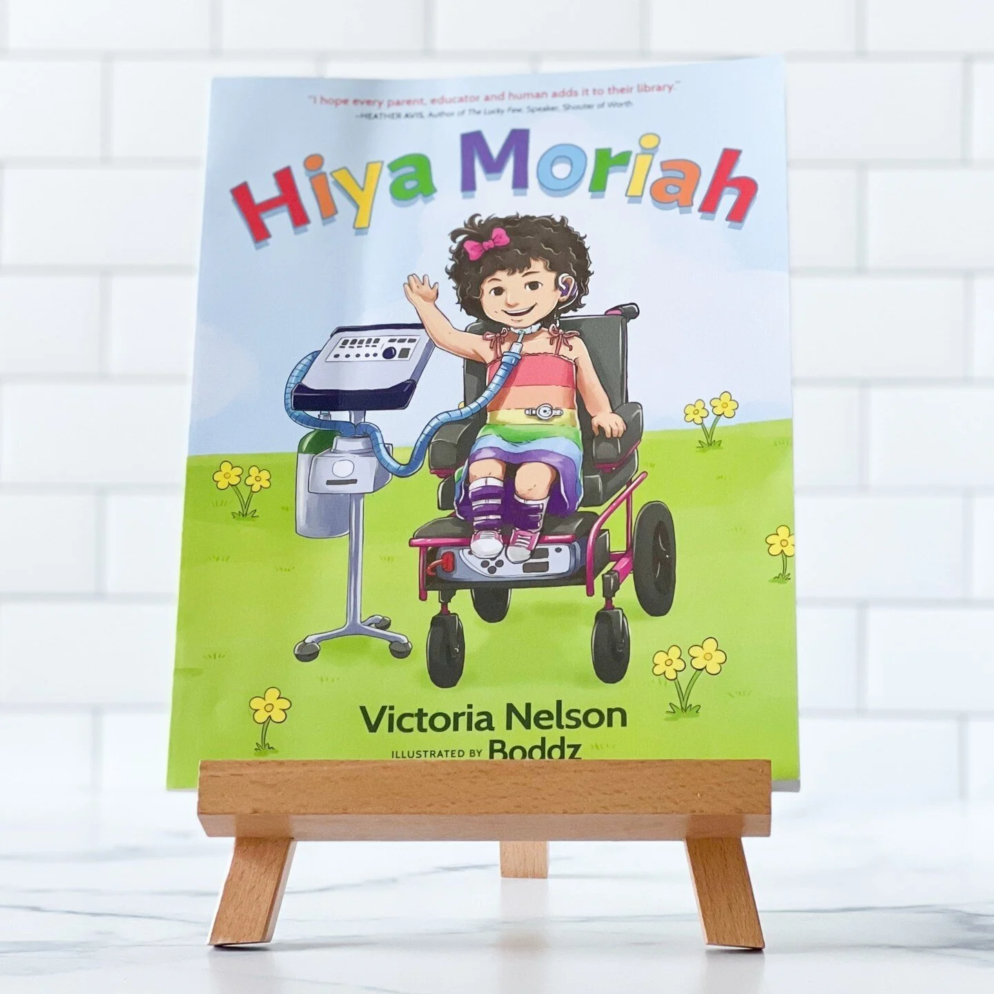 👋🏼 Hiya Moriah 👋🏼⁠
⁠
This read aloud is well-loved in our home (can you tell by the bent upper left hand corner?)⁠
⁠
Hiya Moriah is a beautiful story about a medically complex little girl, her helpers, and her friends. Moriah was born with CHARGE