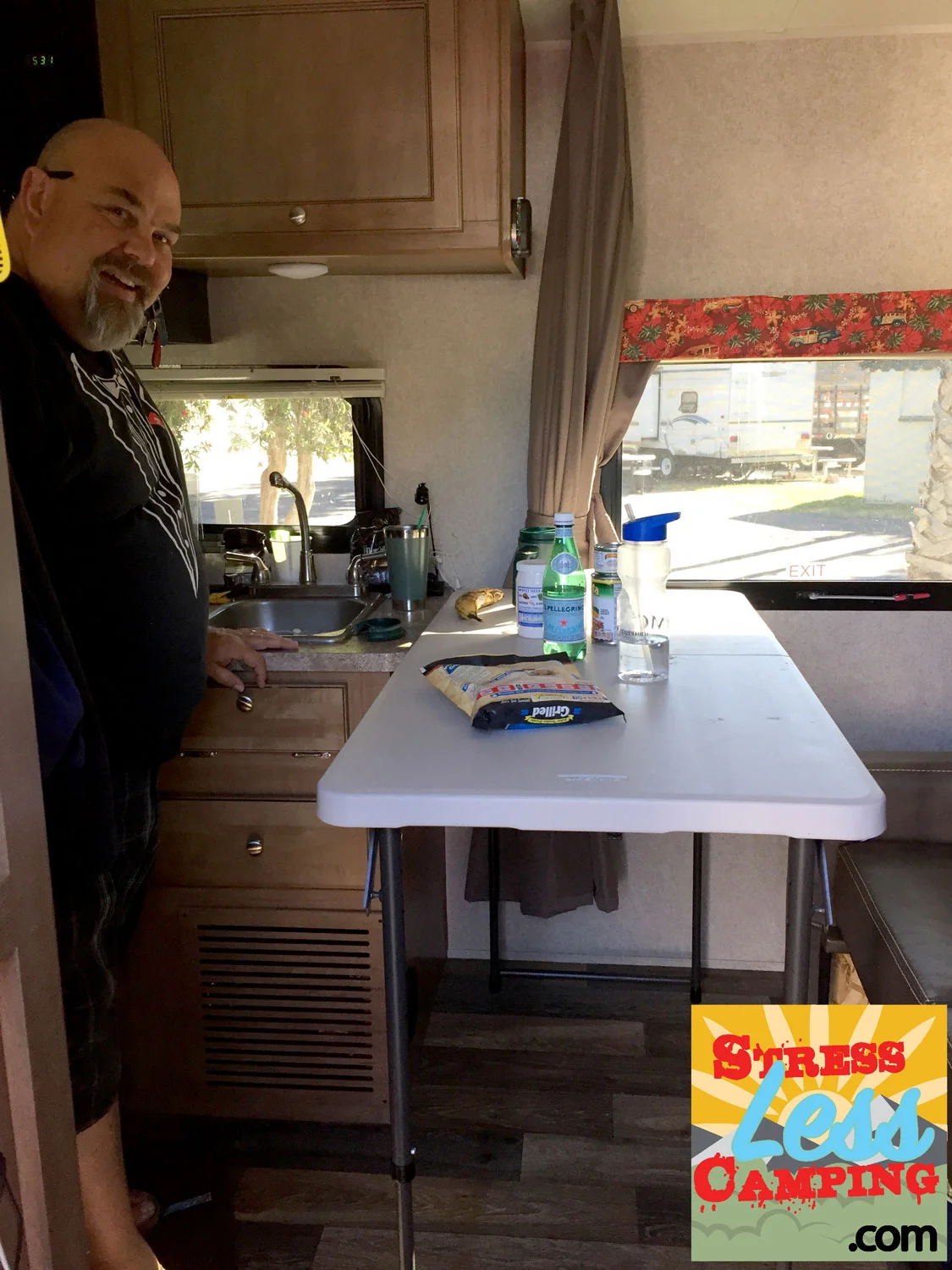 A folding table that can adjust to counter height adds a remarkable amount of prep space to a tiny kitchen.
