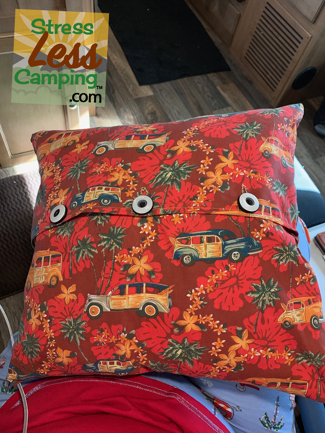 I simply recovered the pillows with woody-themed fabric and even used hubcap-themed buttons!