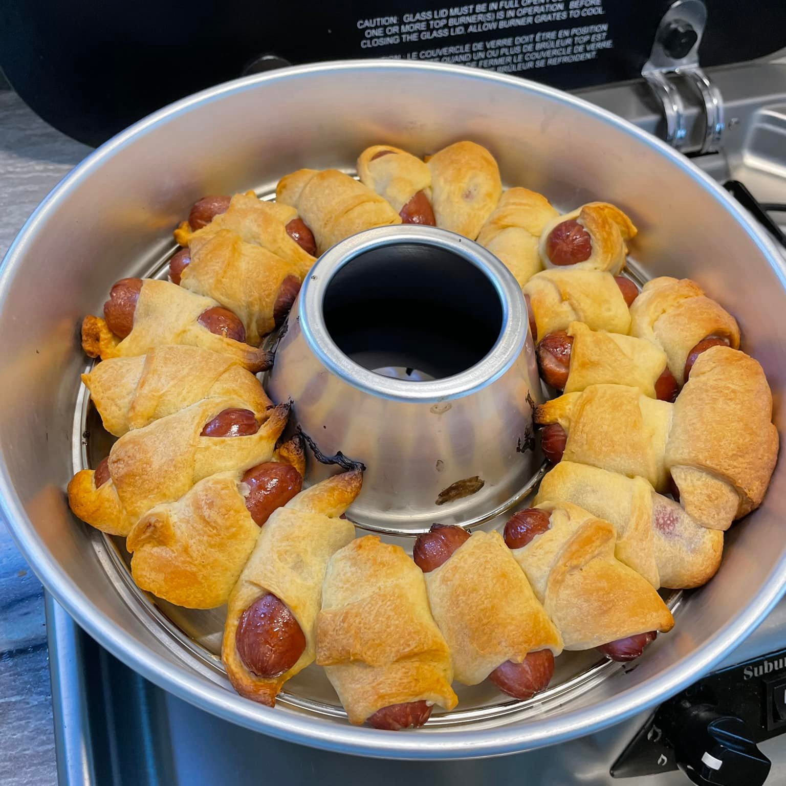 https://images.squarespace-cdn.com/content/v1/5aad3b68697a98cf4d0aa9ba/1679333807645-O9ACEXDXN5SCOPFOUX1C/Omnia+oven+weenie+bake.jpg