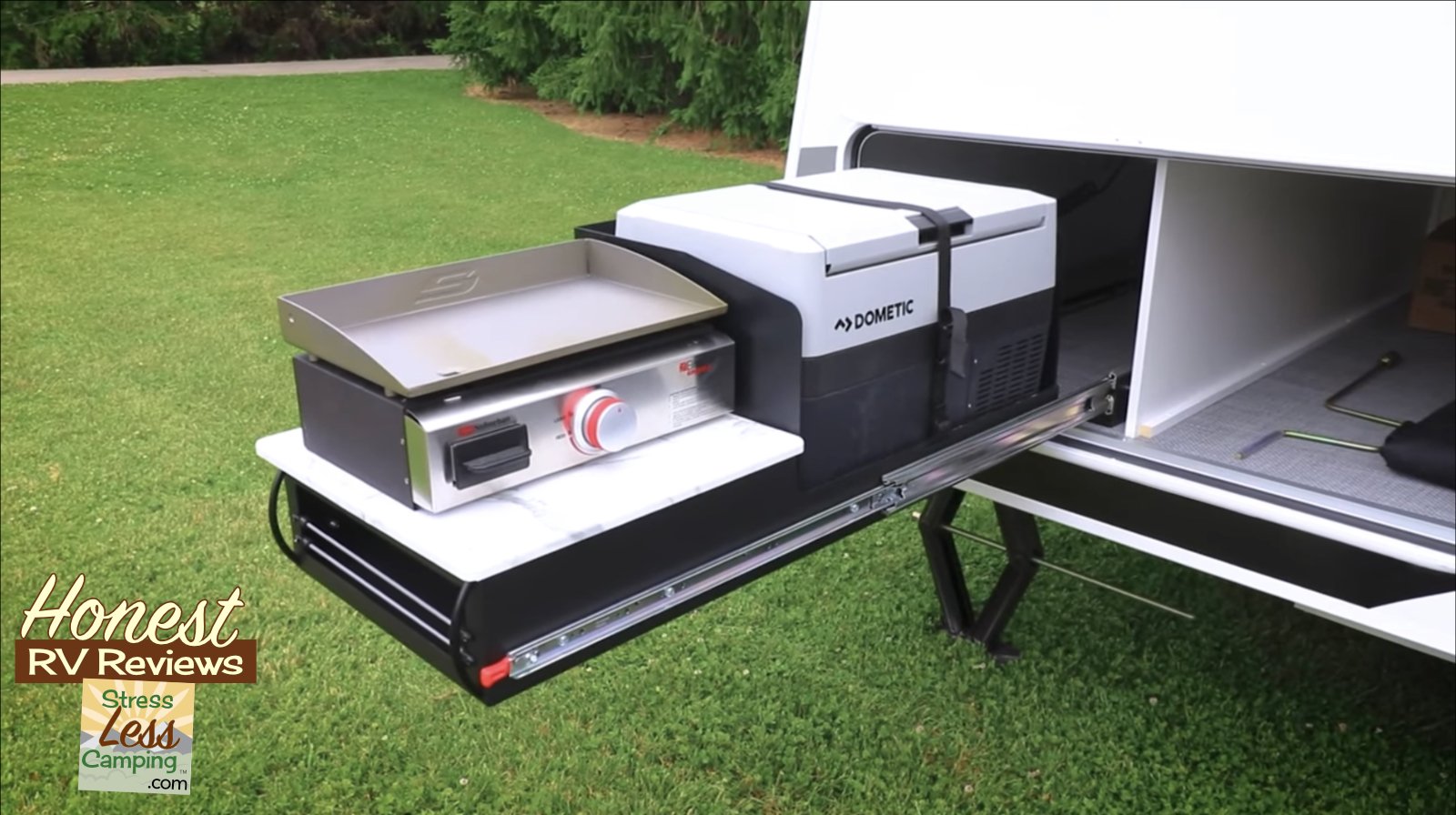An optional outdoor kitchen features a flat-top griddle and 12 v (Copy)