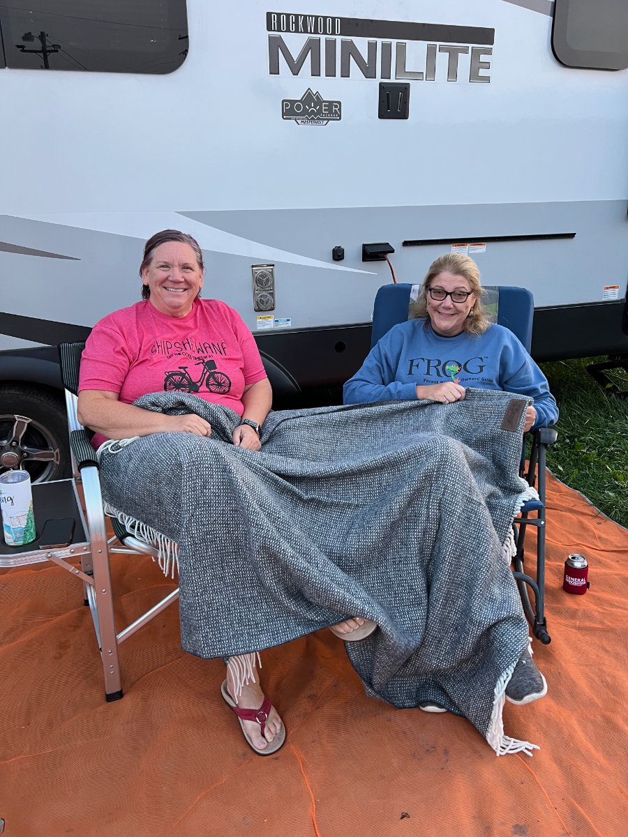 RVers Peggy Barthel (L) and Tina Armeni (R) enjoy a shared blanket on a chilly night of conversing.jpg