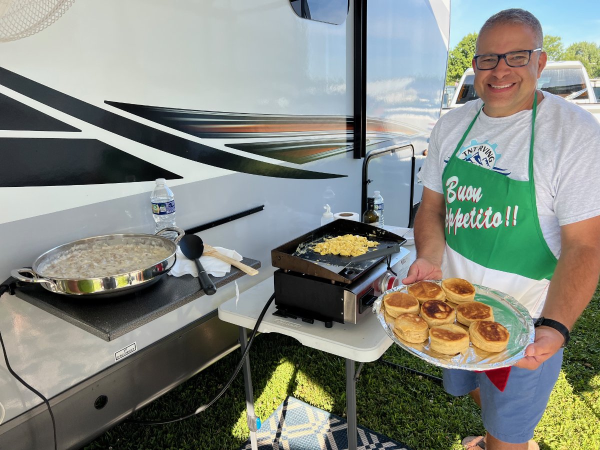 Tony Ameni from TNTRV YouTube channel and Rockwood Mini Lite brand ambassador serves up breakfast for guests.jpg