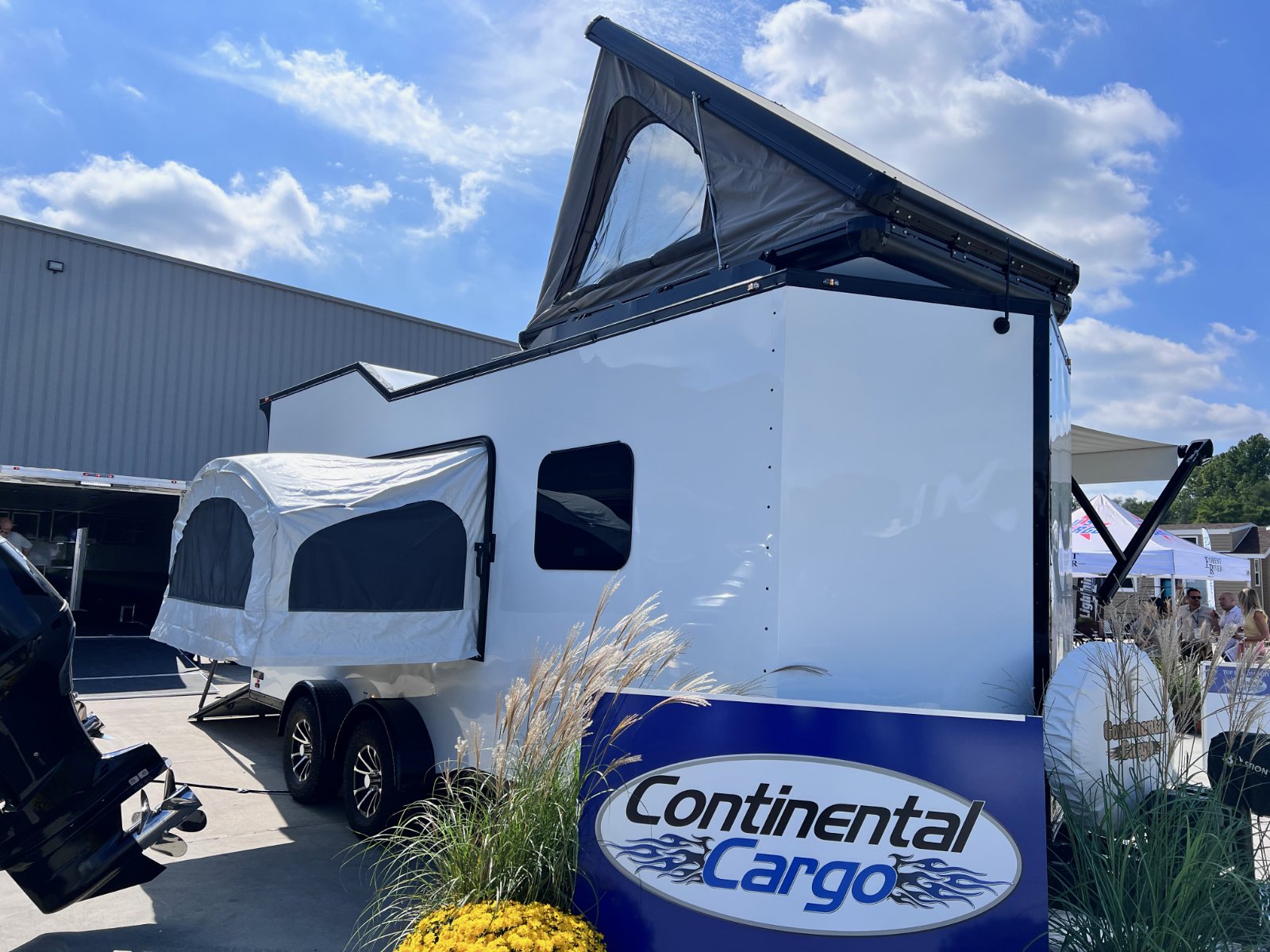 A roof-top tent and pop-out side tent are options on the Continental Cargo Trailers Weekender.jpg