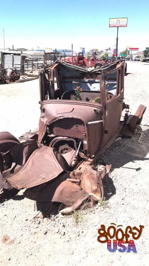 Some of the cars whose final resting place is the Roadkill Cafe in Seligman.jpg