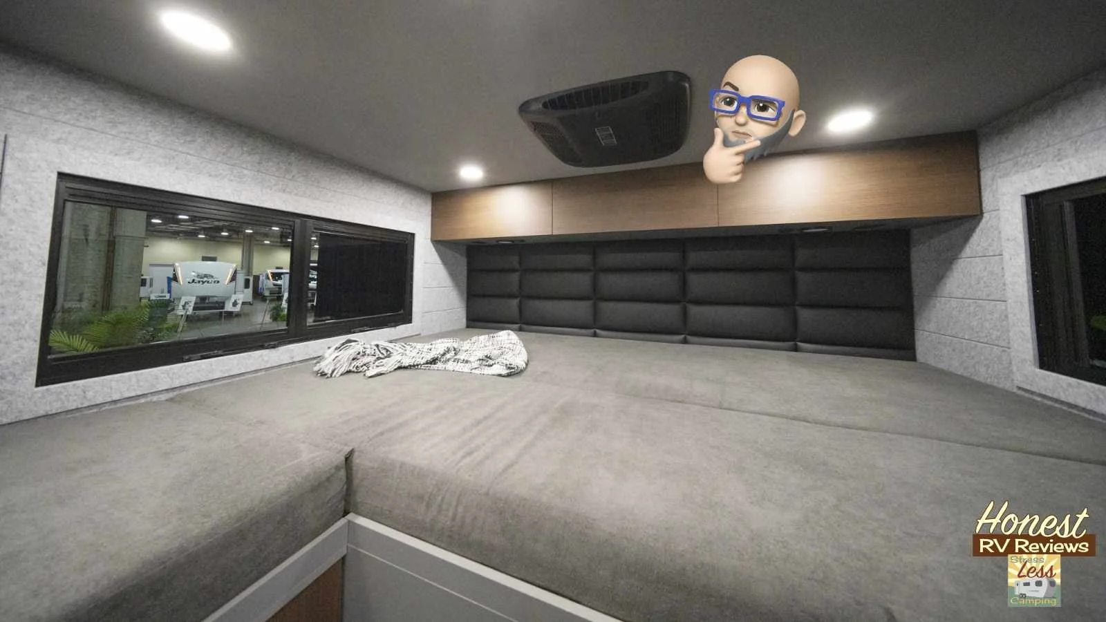The bed is raise to accommodate the rear storage and is a full queen-sized bed.jpg