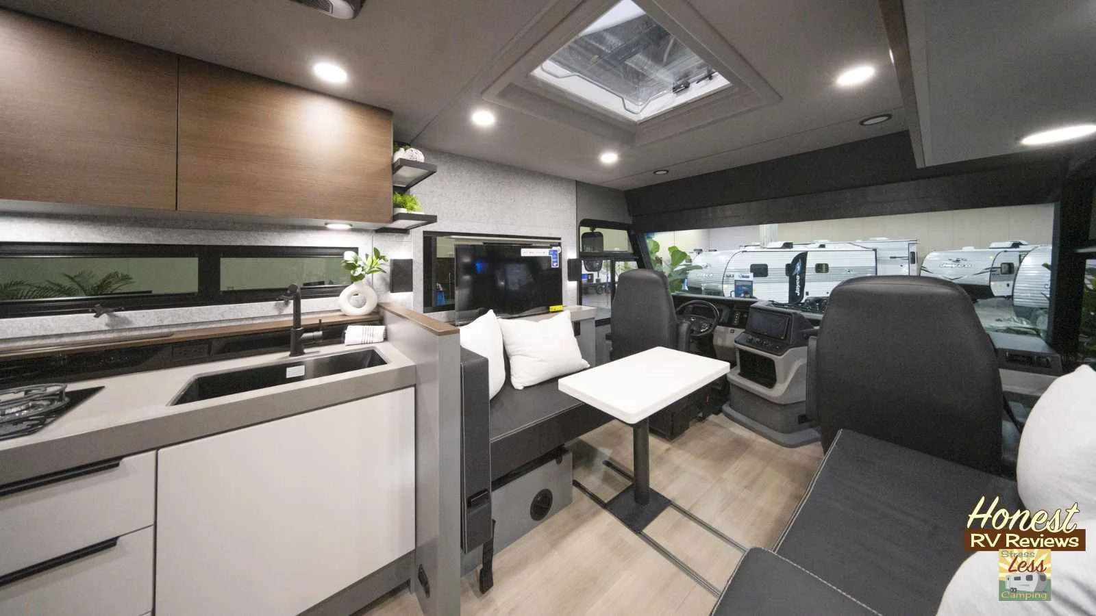 The second-row seating in the Jayco Embark EV RV serves as a dinette.jpg