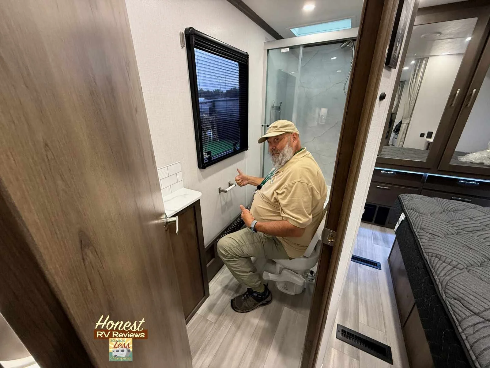 Checking the space around the toilet of the Dynamax Isata 5 Xplorer Edition.jpg