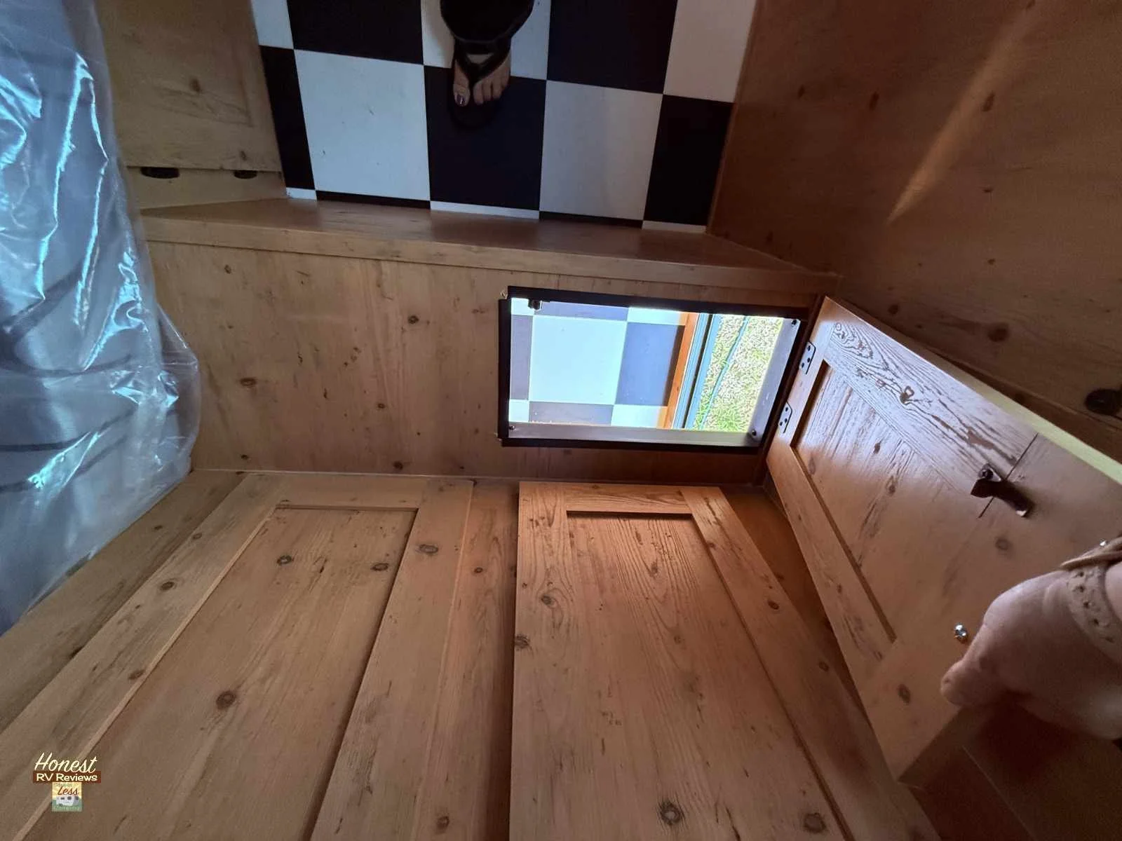 A pass-through to the front storage bay is a great way to take care of laundry in the Sunset Park Retro Betty 196.jpg