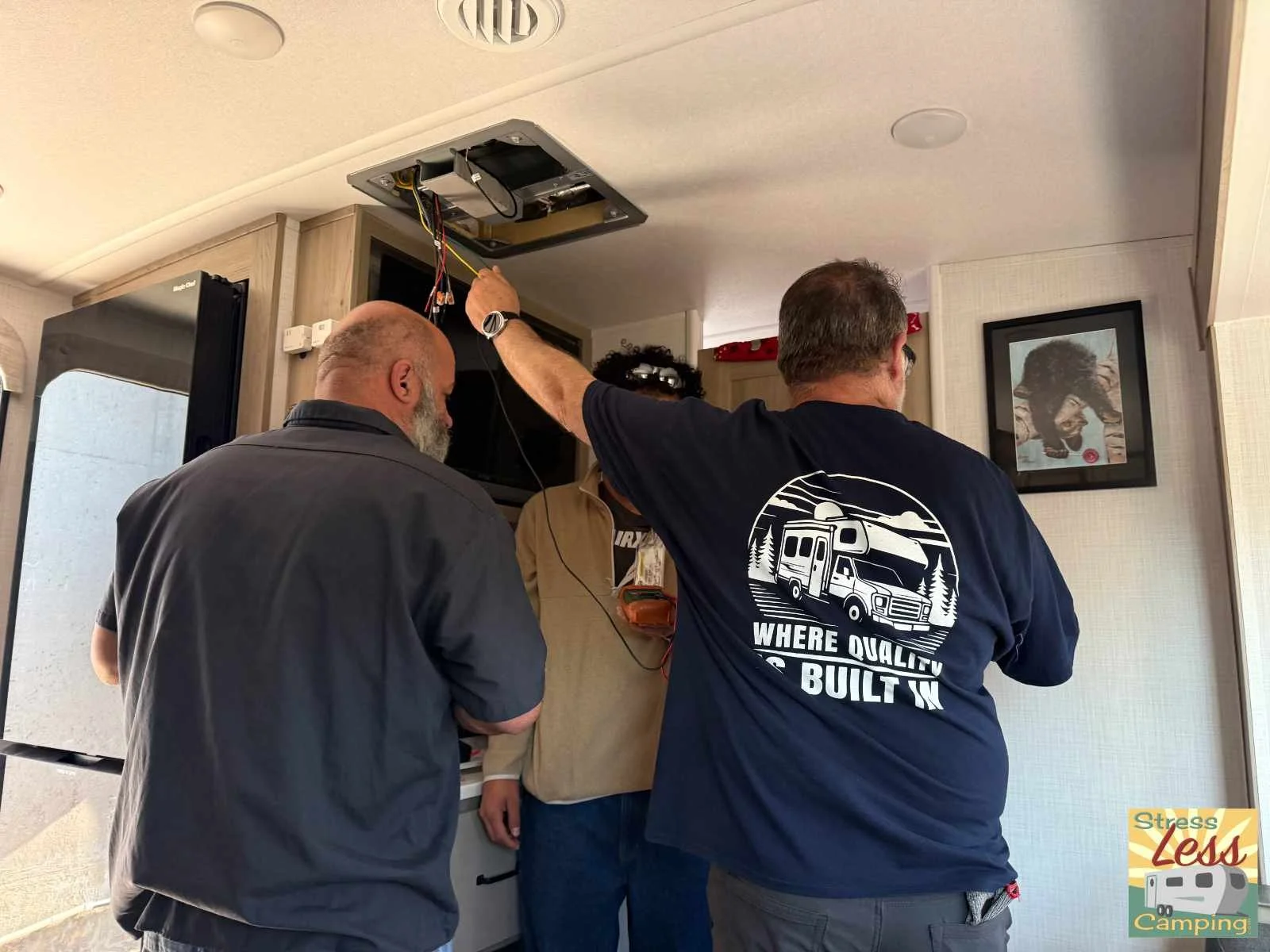 The AirXcel team works to perfect the installation of the Coleman Mach Everest VS-18.jpg