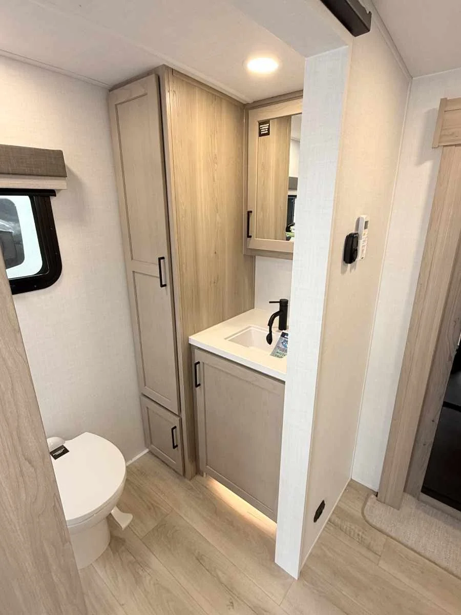 A vanity in the bathroom features a night light in the toe kick area.jpg
