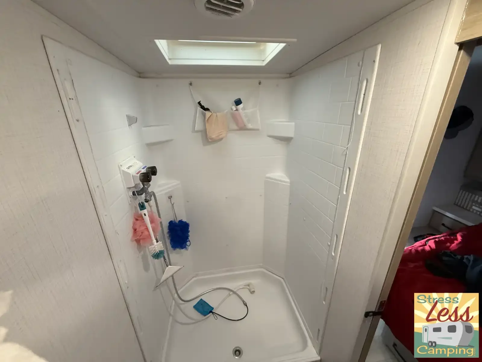 Our RV's shower before the new Nautilus door gets installed.webp