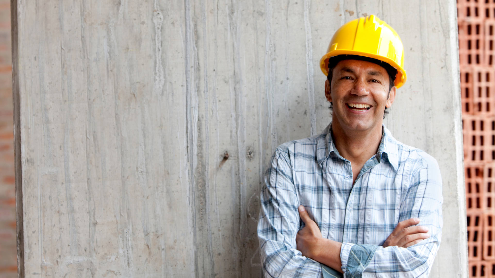 Construction worker onsite in a yellow hard hat