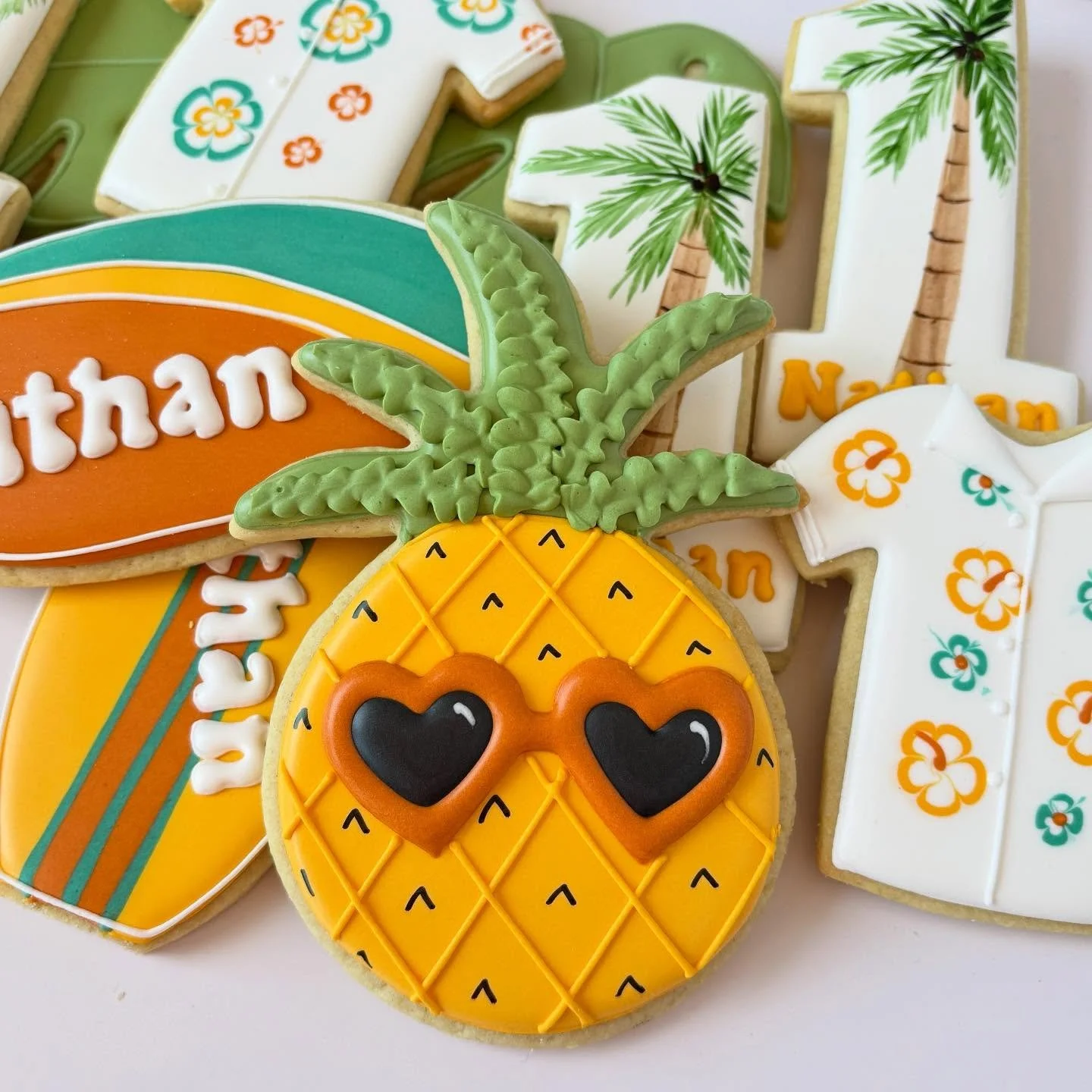 Happy First Birthday Nathan!
🏄 🍍 🎂 

#oregoncookier
 #decoratedcookies #decoratedsugarcookies #royalicing #cookieart #sugarcookies #partyfavorcookies #customcookies #cookiesofinstagram #cookiegram #instacookie #portlandcookiemaker #portlandcookies