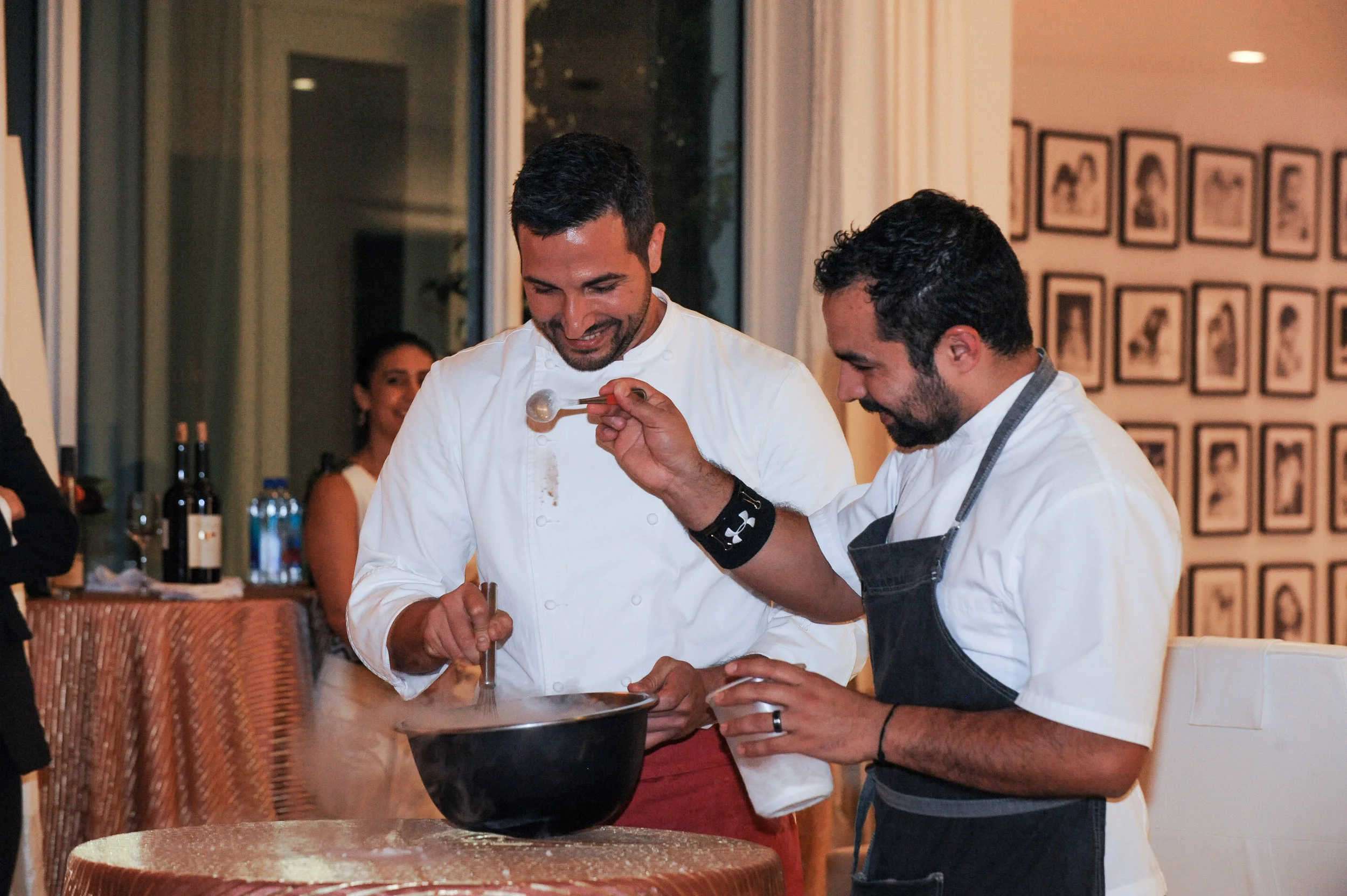Chef Minas and Chef Christopher Nunez demonstrating orange sorbet made with liquid nitrogen