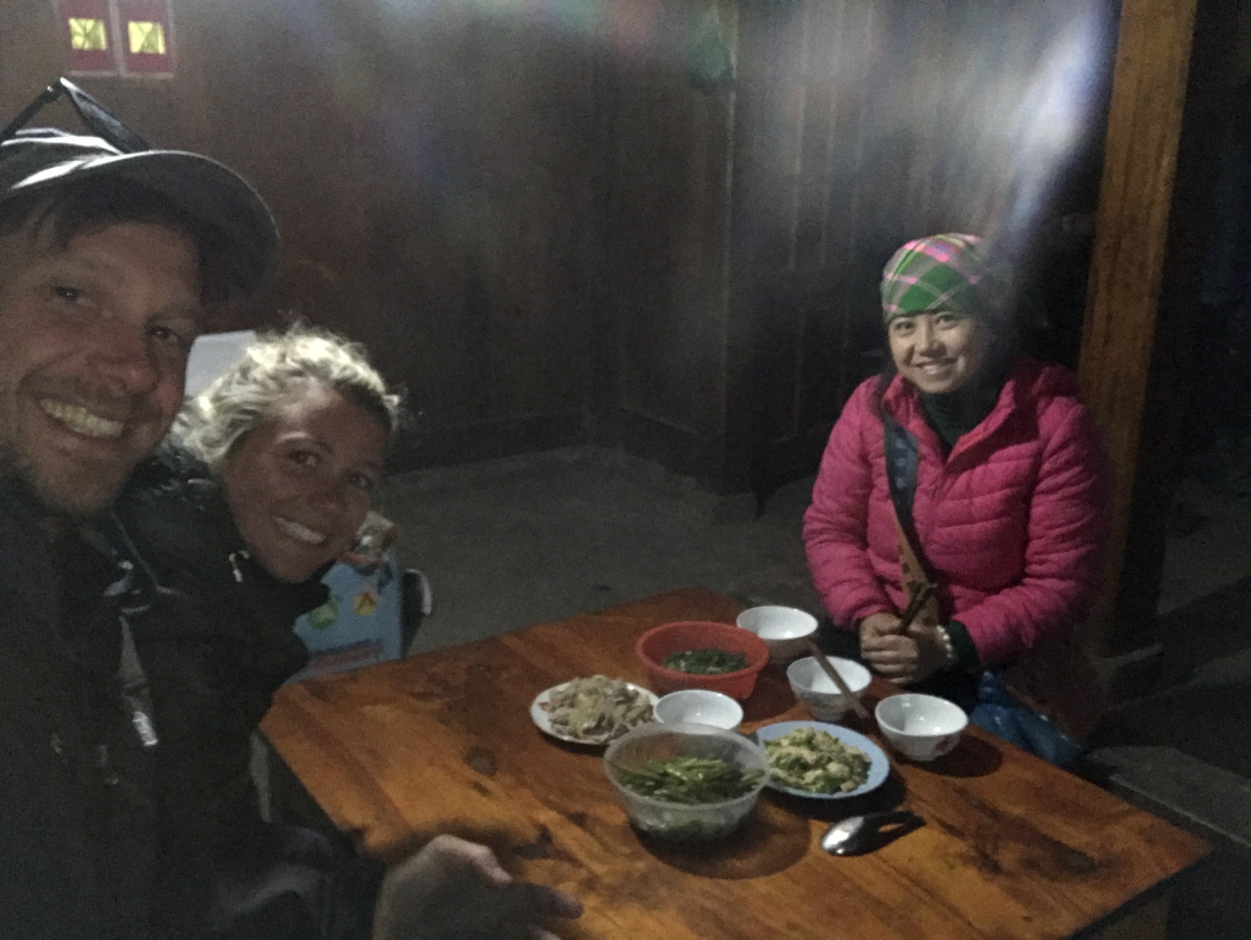 Giang (Zao) and Katie &amp; Tom sharing lunch prepared by a local family in their home