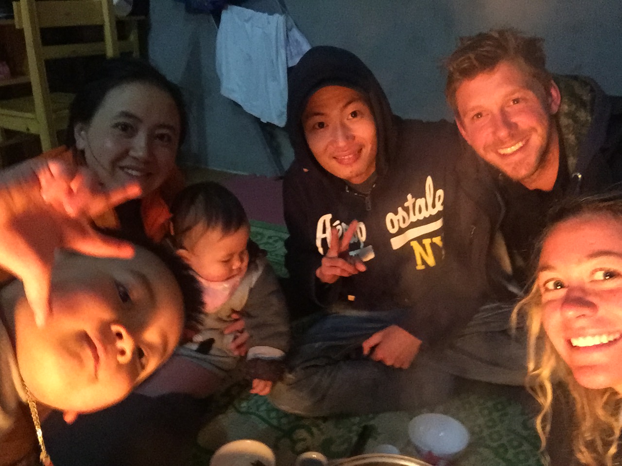 Giang (Zao) and Katie with their families enjoying a delicious meal at Zao's home