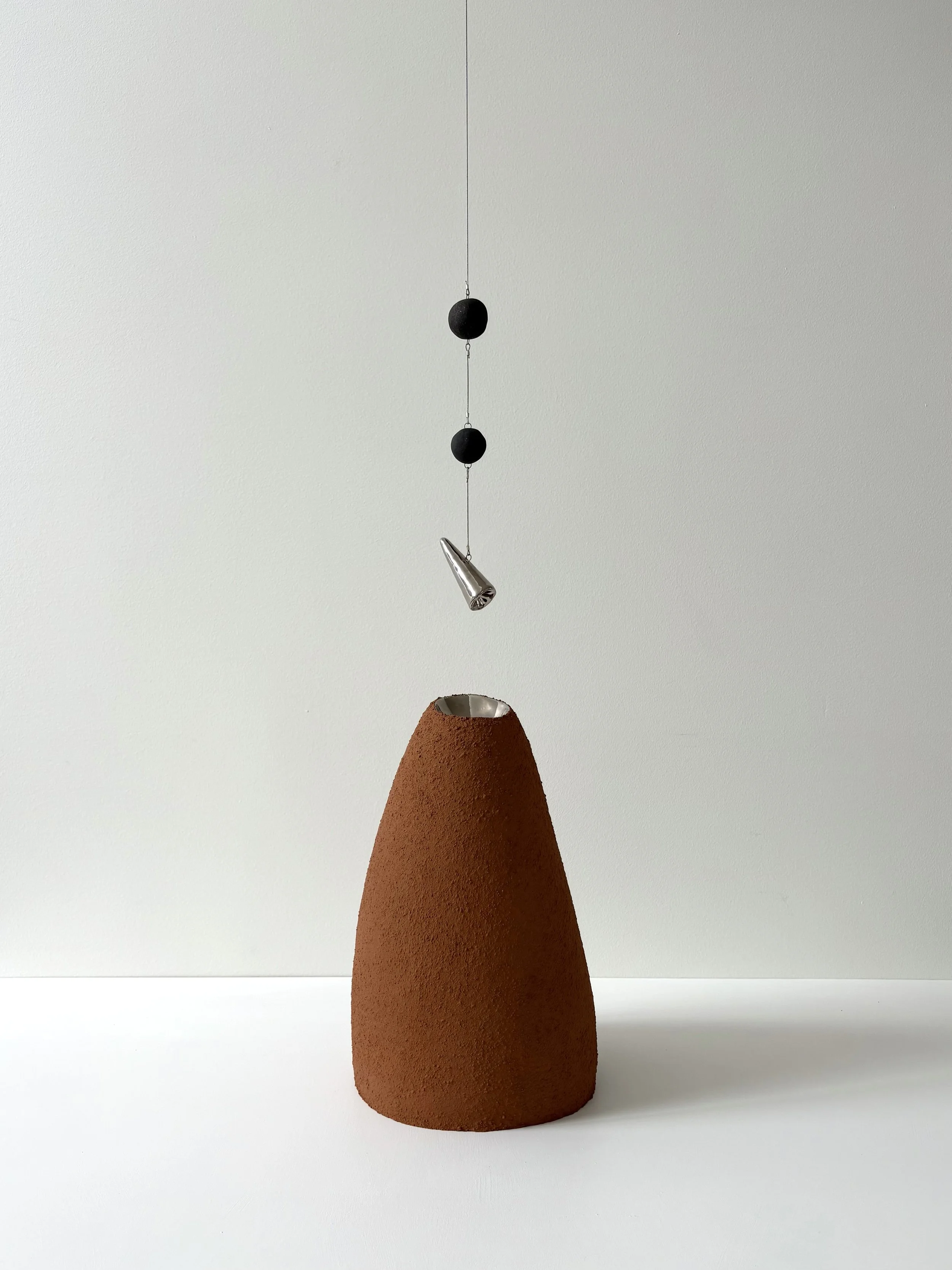 Neech_Britt_Single form (reflection stone with hanging elements).jpeg