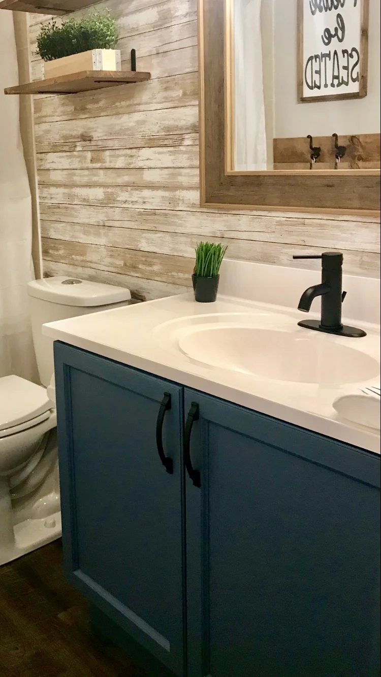 This was a powder room in our previous home, the vanity was painted with BEHR® Alkyd Blue Print I