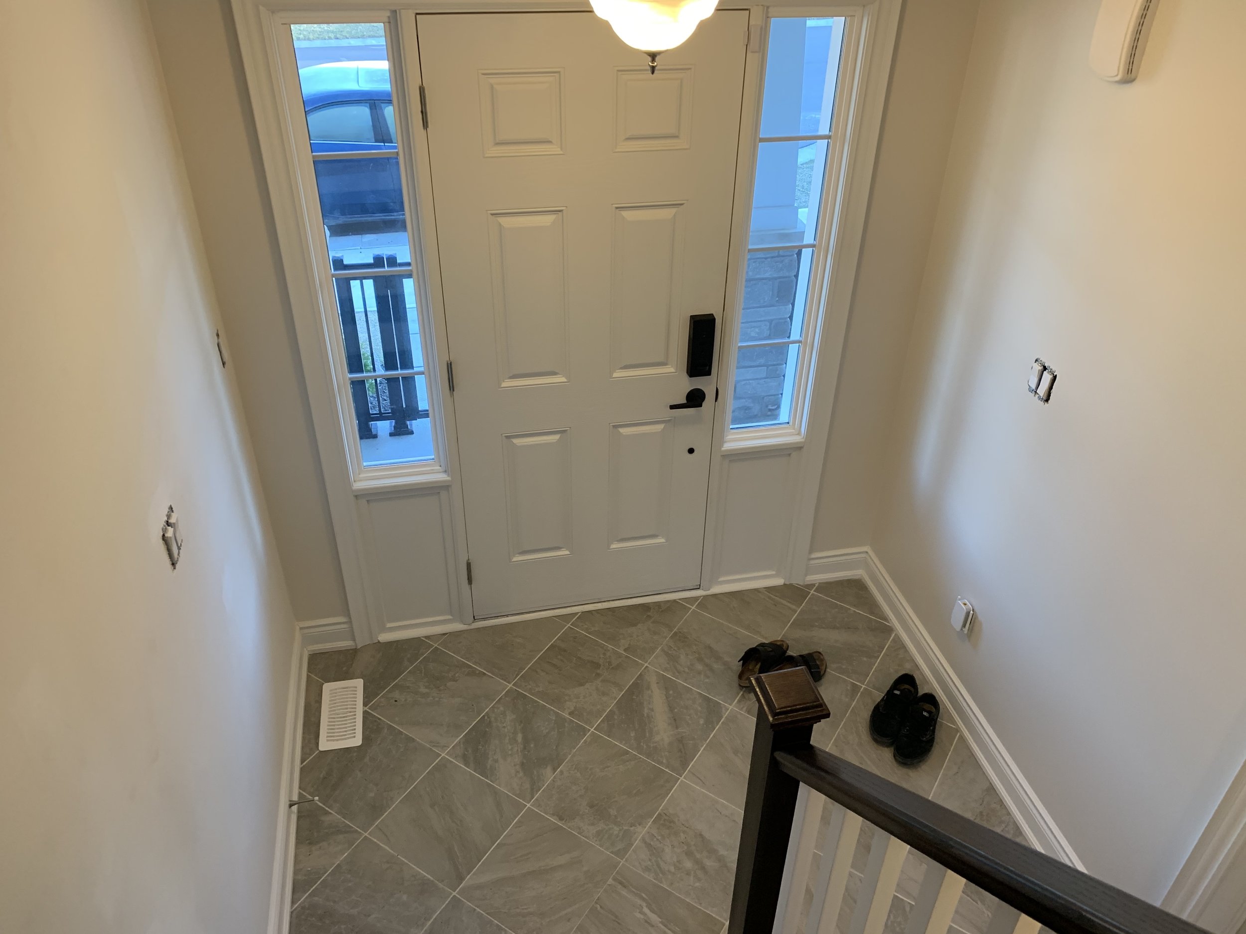Entry way BEFORE in all it’s “builder beige” glory!