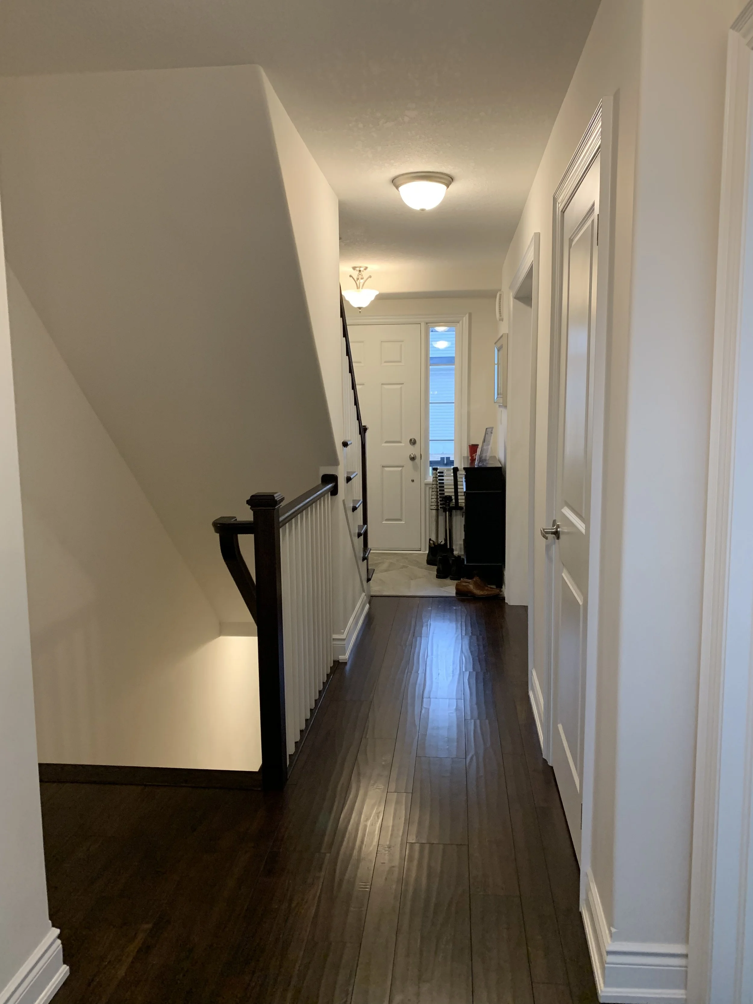 Hallway leading from kitchen to entryway/front door - Before