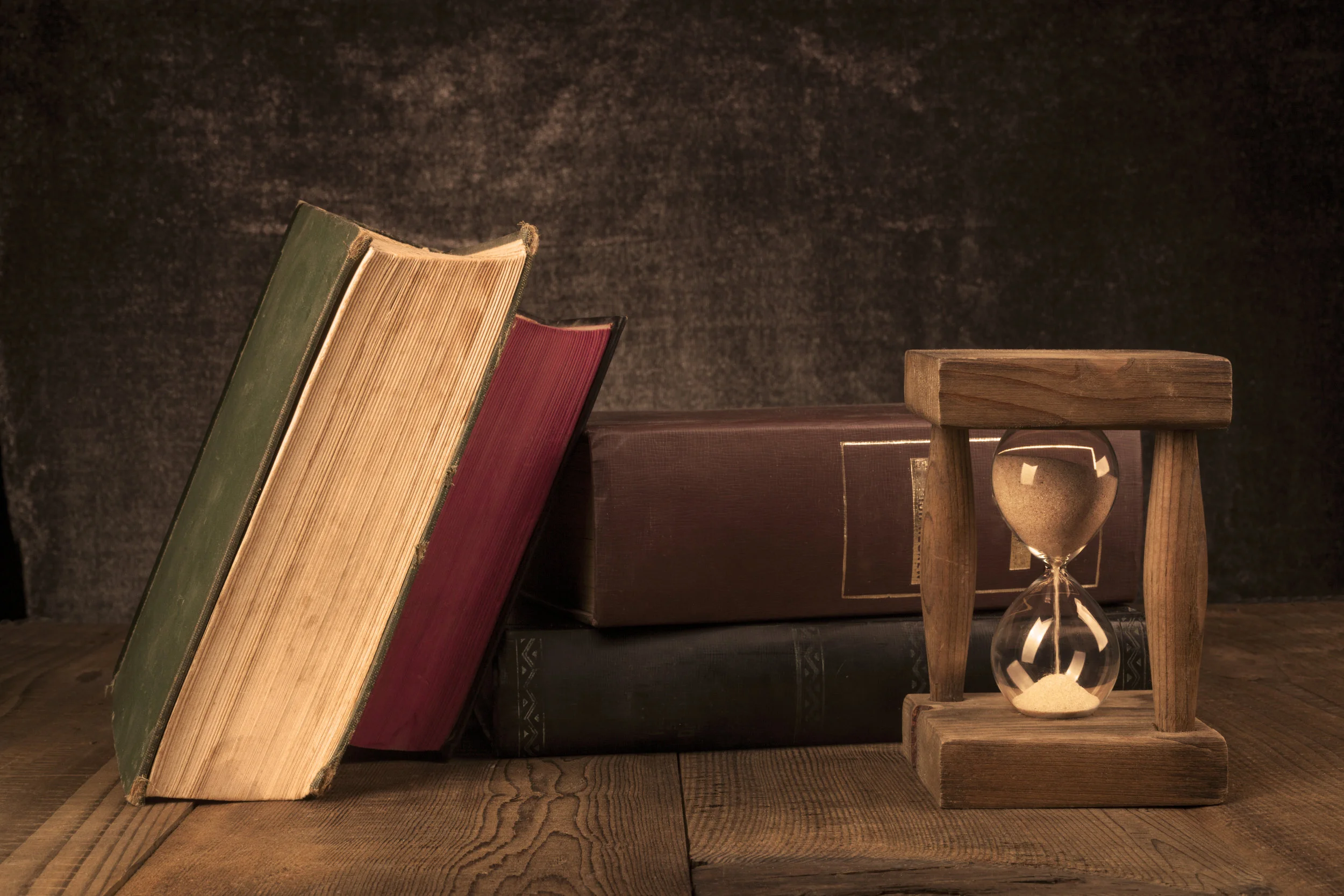 old-books-with-hourglass-RW8XA7S.jpg