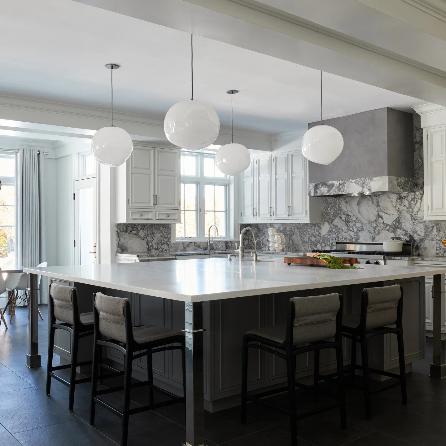 Kitchen facelift! The focus of this project was initially new counters, floors, and an island. The kitchen is very large and was cabinet-heavy, so we took the construction opportunity to look at how the client was using each cabinet and how they coul