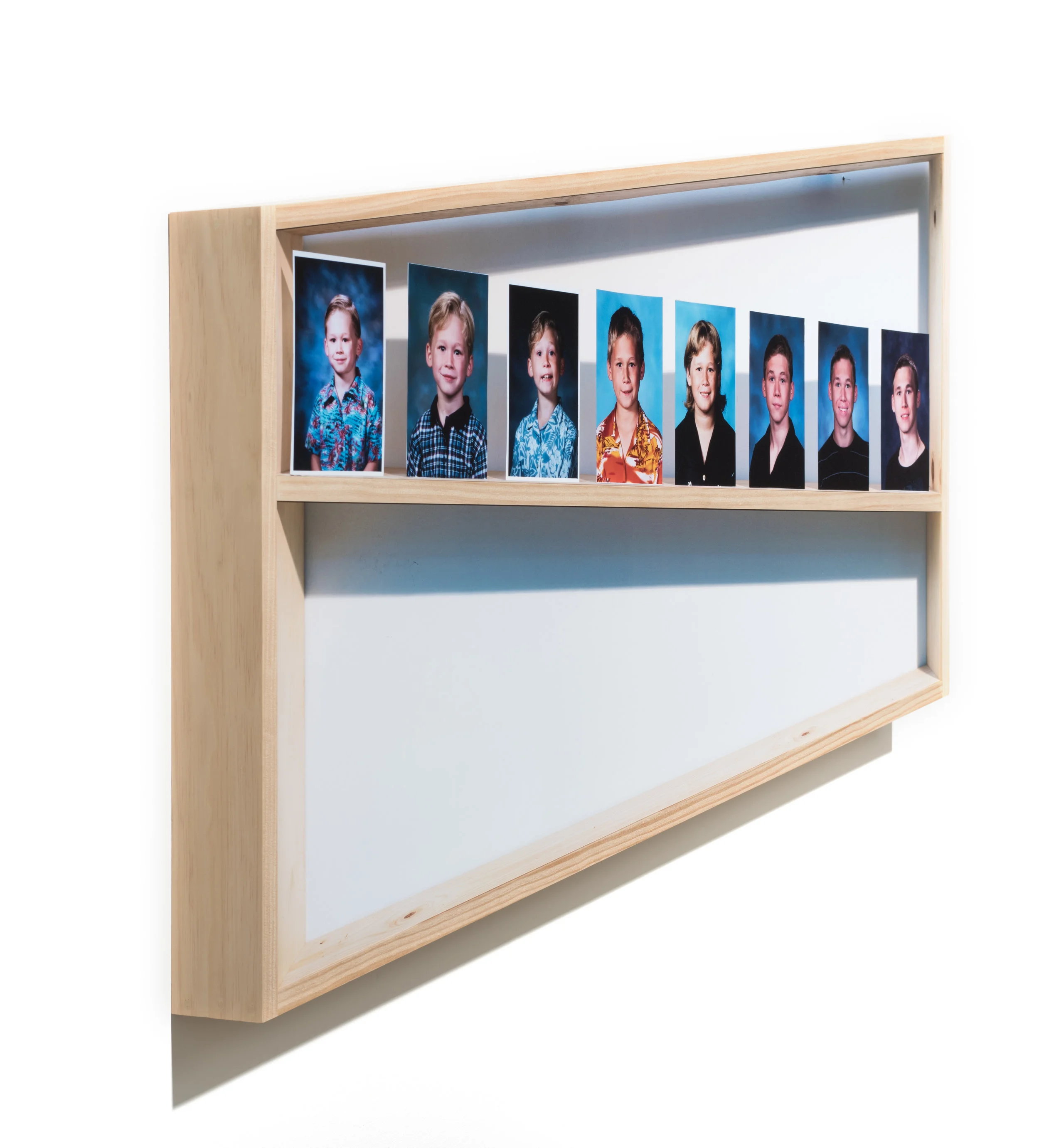 Growing Pains (side view), 2018 Archival pigment prints and wood 30 x 51 1/2 x 3 1/2 inches ————