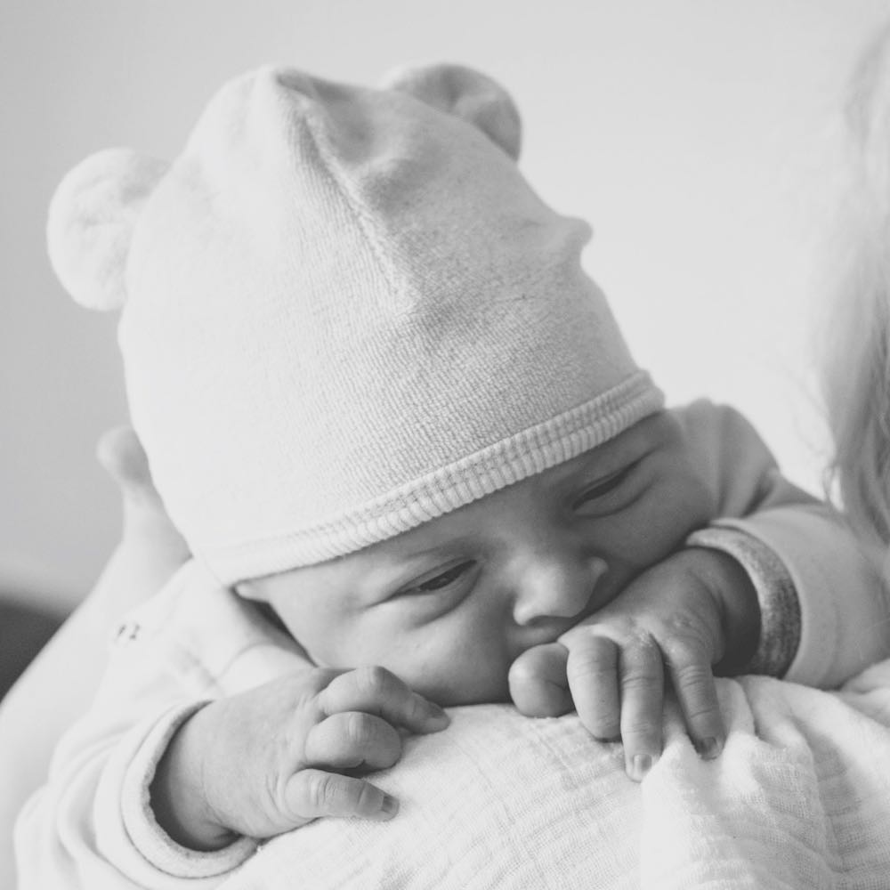 newborn-baby-on-grandmother's-shoulder-echo-grid-453786-unsplash (1).jpg