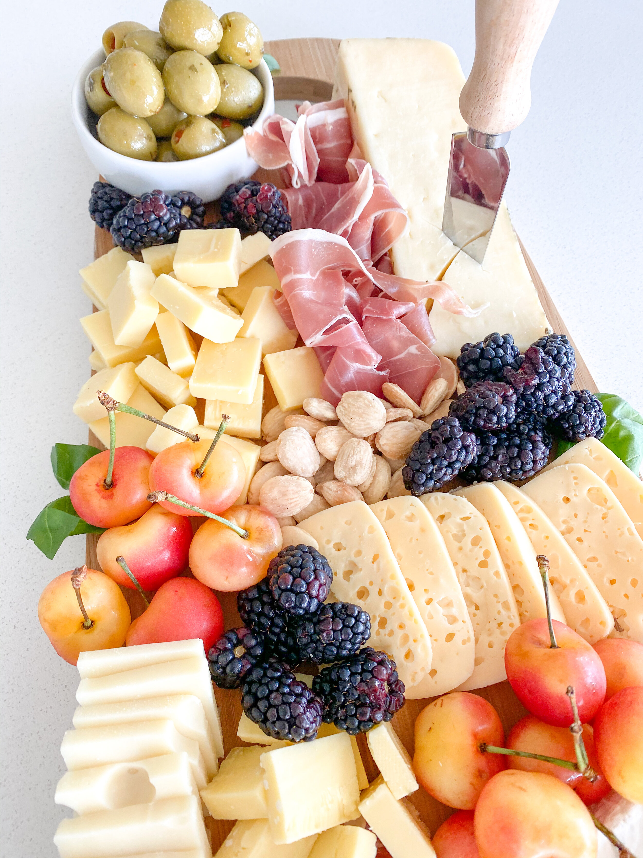 www.tarynintotravel.com | Summer Inspired Charcuterie Board | Cheese Board | Meat and Cheese | Fruit | Cheese Honey | Easy Charcuterie Board