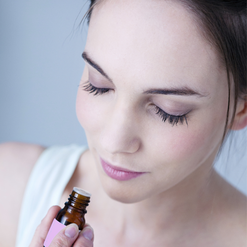 Woman-smelling-bottle-x500.png
