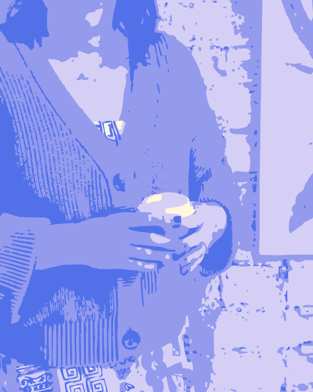 Creative professional holding a coffee during a focused work session.