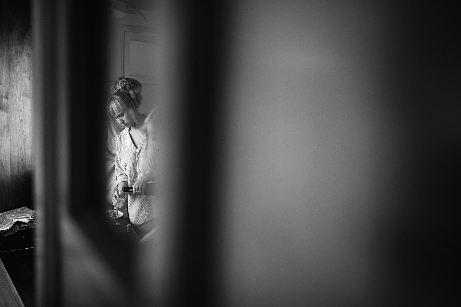 Reflection of bridesmaid in the mirror