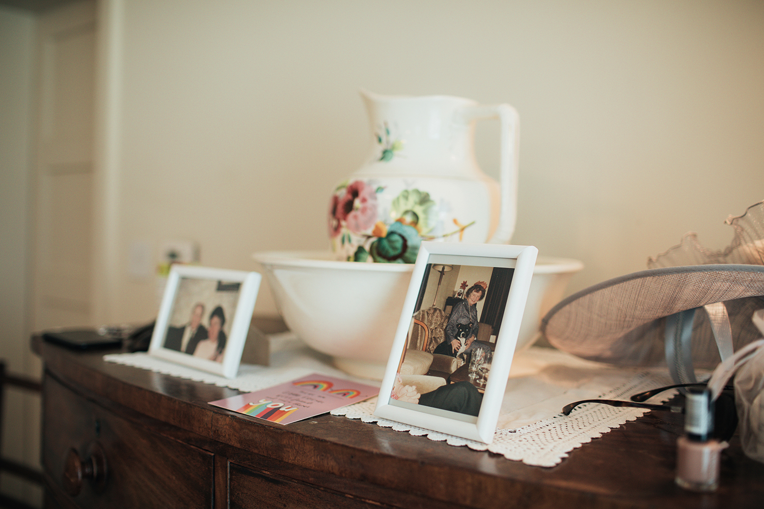 Framed photos of grandparents on dresser