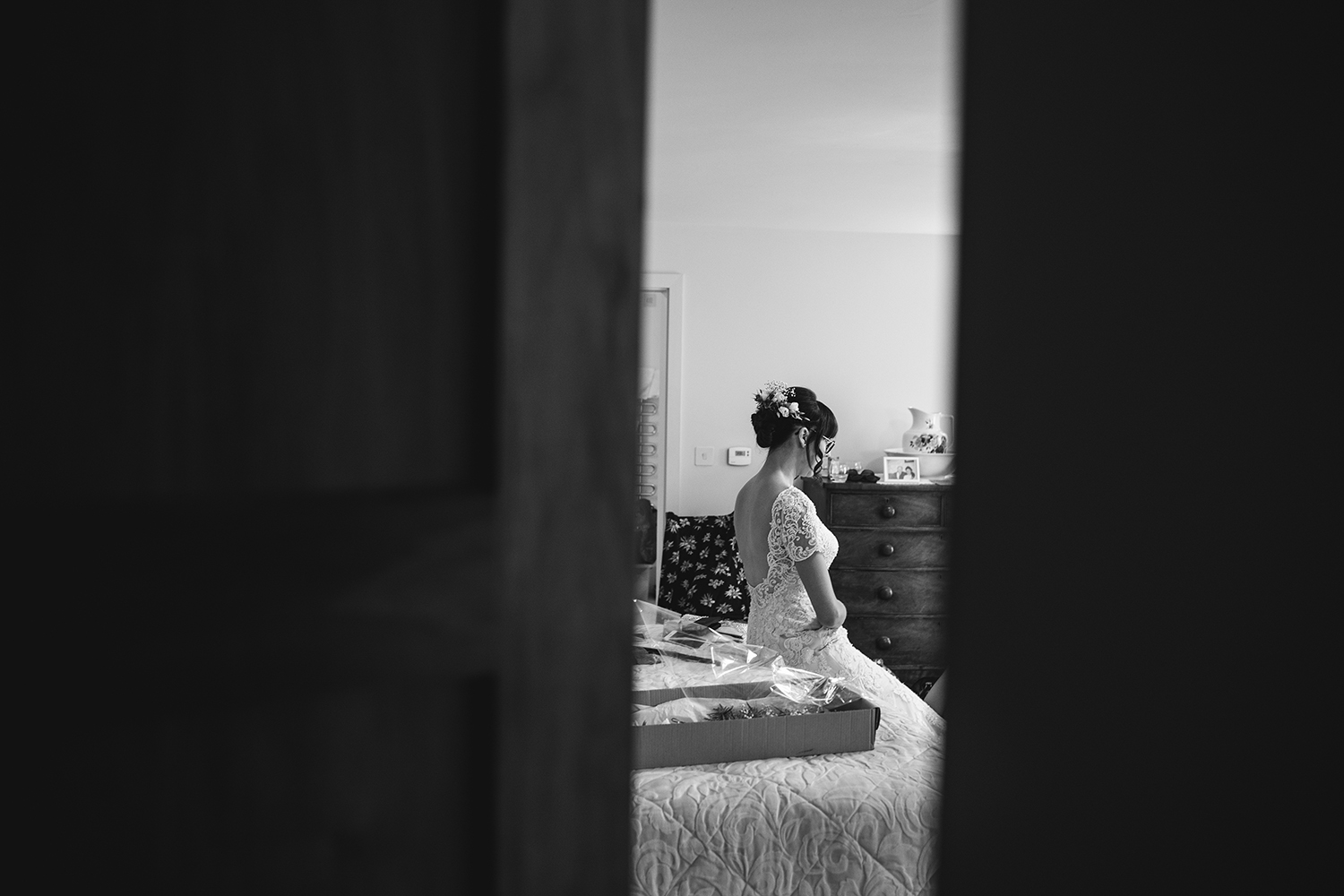 Bride sat on the bed