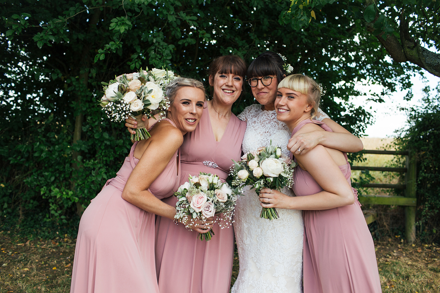 Bridal party hugging