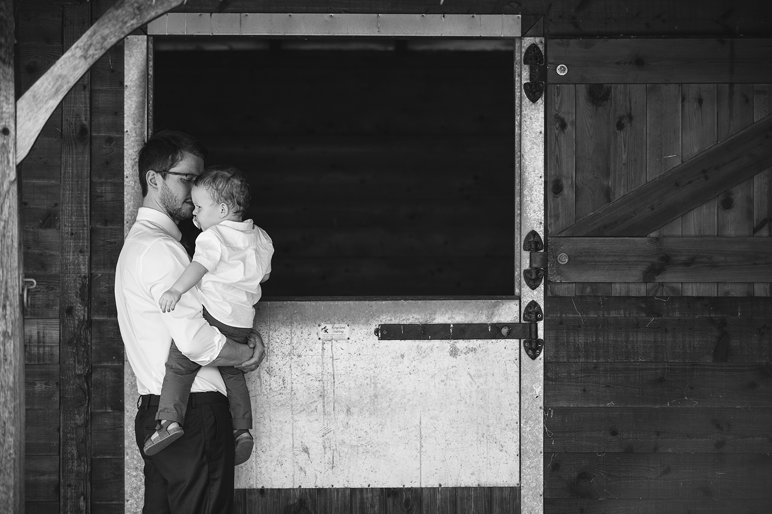Man and child at stables