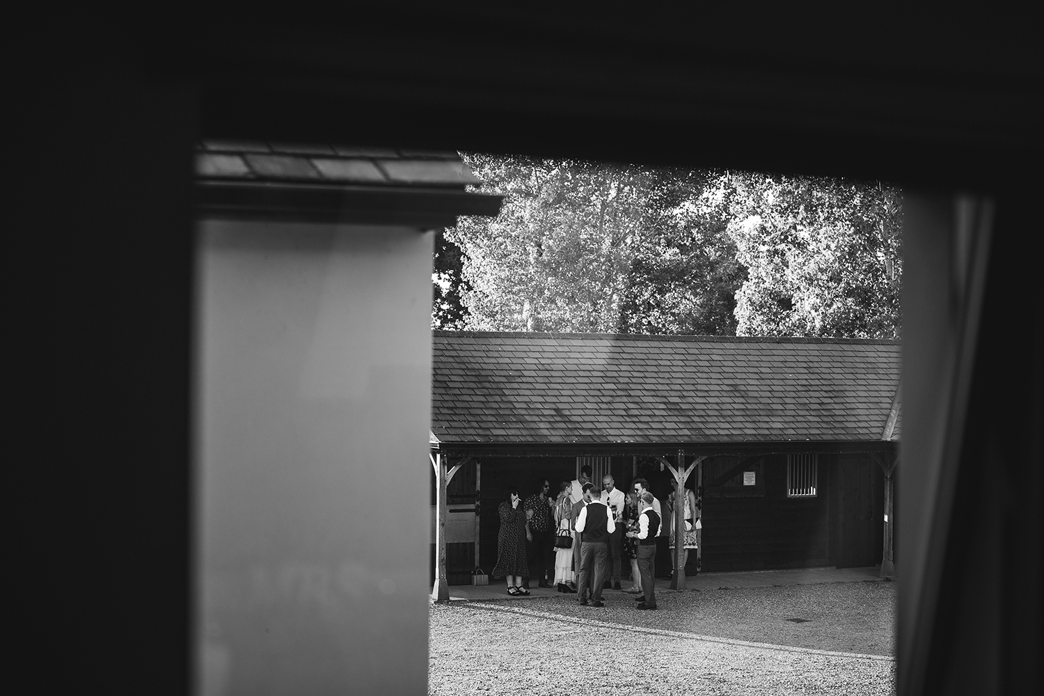 Wedding gusts in front of stables