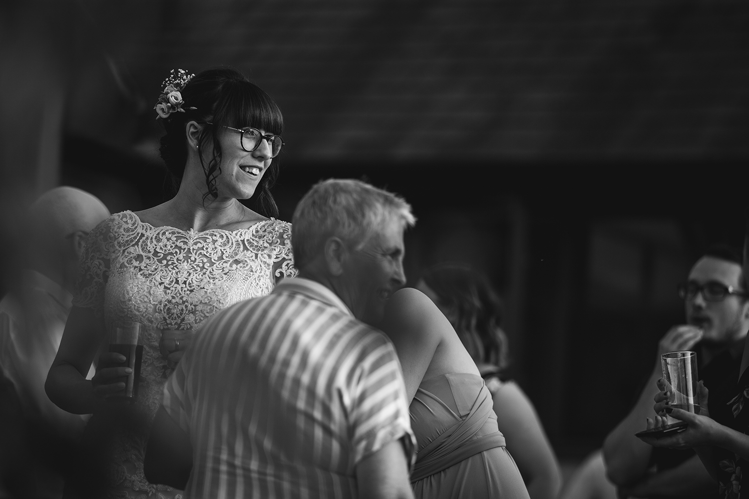 Bride smiling at guests